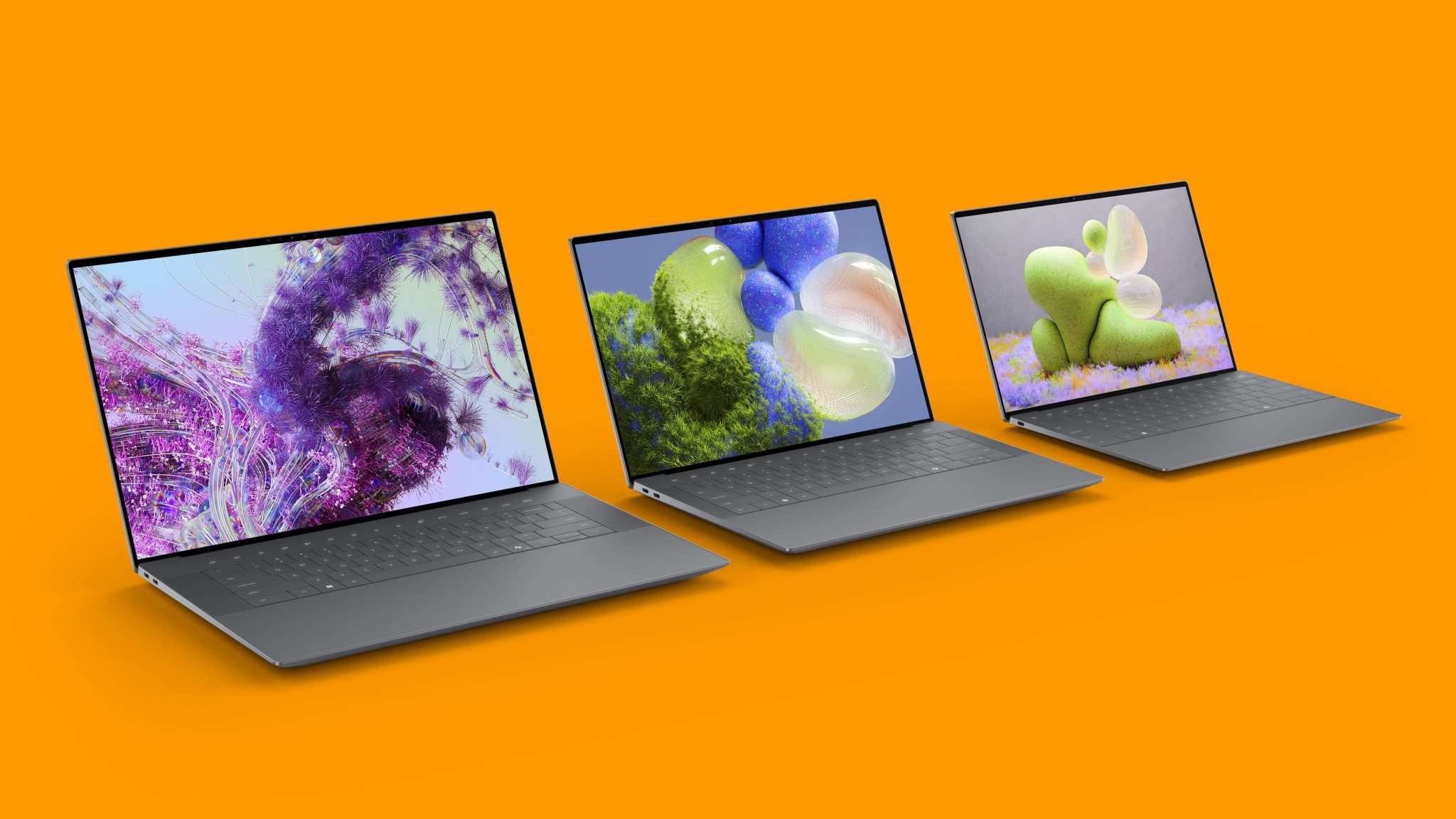 Dell XPS-Notebook-Serie 2024 vor orangefarbenen Hintergrund.